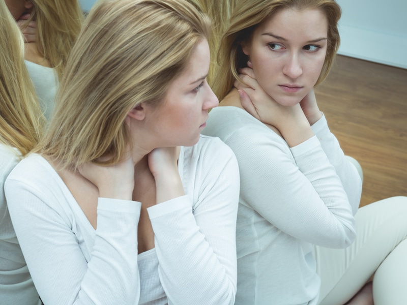 Conditions of Worth - Woman looking at reflection Conditions of worth are the messages we take on board about what we have to do to be valued by other people.