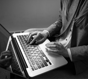 Online Therapy Competencies -professional using laptop Counsellor with Online Therapy Competencies using laptop for counselling