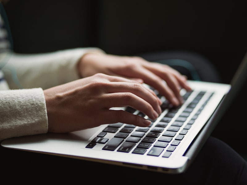 Writing a counselling case study - hands over a laptop keyboard Writing a counselling case study - hands over a laptop keyboard