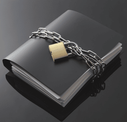 a-file-book-with-a-padlock Counselling and the Law - a black file book bound in chains and a padlock to communicate confidentiality